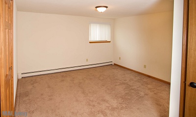 Carpeted Bedroom in 1 Bedroom