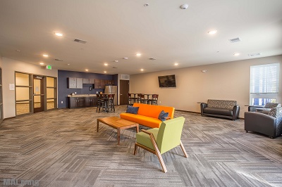 Tastefully Decorated Community Room with Seating & Kitchenette